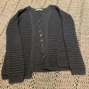 Knitted sweater with braided back.